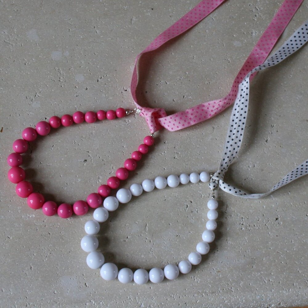 Child Faux Pearl Necklace with Ribbon.